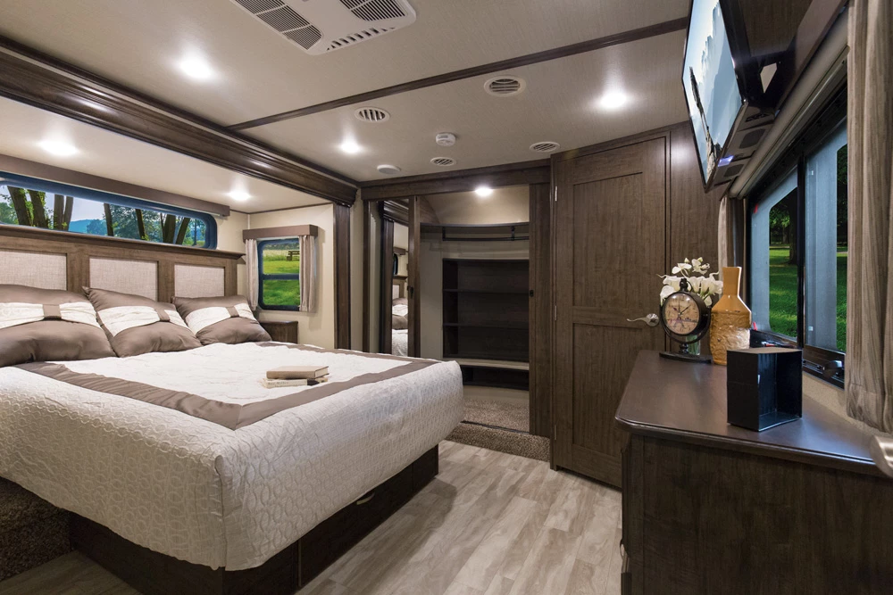 Large bed in a travel trailer room