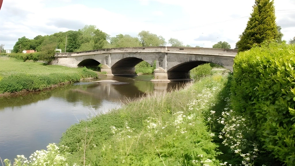 Pont en pierre de Wolseley enjambant une rivière entourée de verdure, représentant une halte pittoresque sur la route de Winnipeg à Régina.
